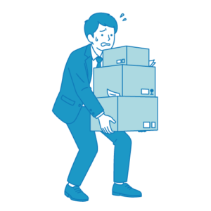 重い荷物を運ぶビジネスマン